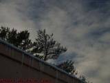 Roofline Icicles and Clouds Foreshadowing Snow, Peabody