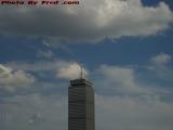 Prudential Tower Standing Into Mixed Clouds and Sun