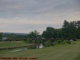 Pedestrian Footbridge Under Cloudy Skies, Island Park