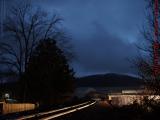 Heavy Solstice Dusk Skies Over Outbound Tracks, Wellsville