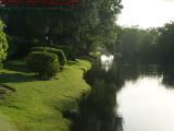 Placid Waterway Lit By Afernoon Sun's Glare, Plantation